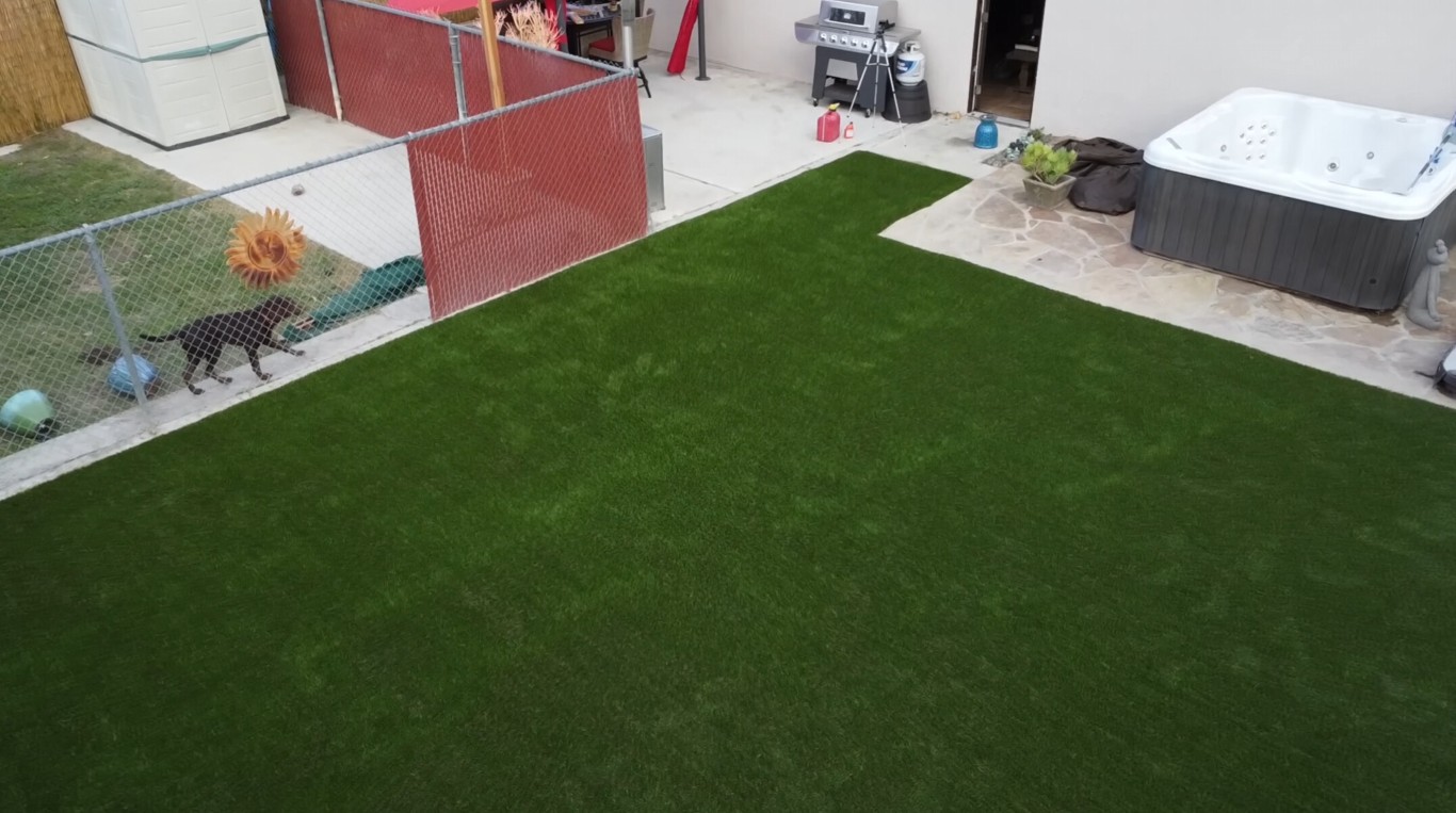 Mud-free artificial grass lawn with hot tub in Torrance home